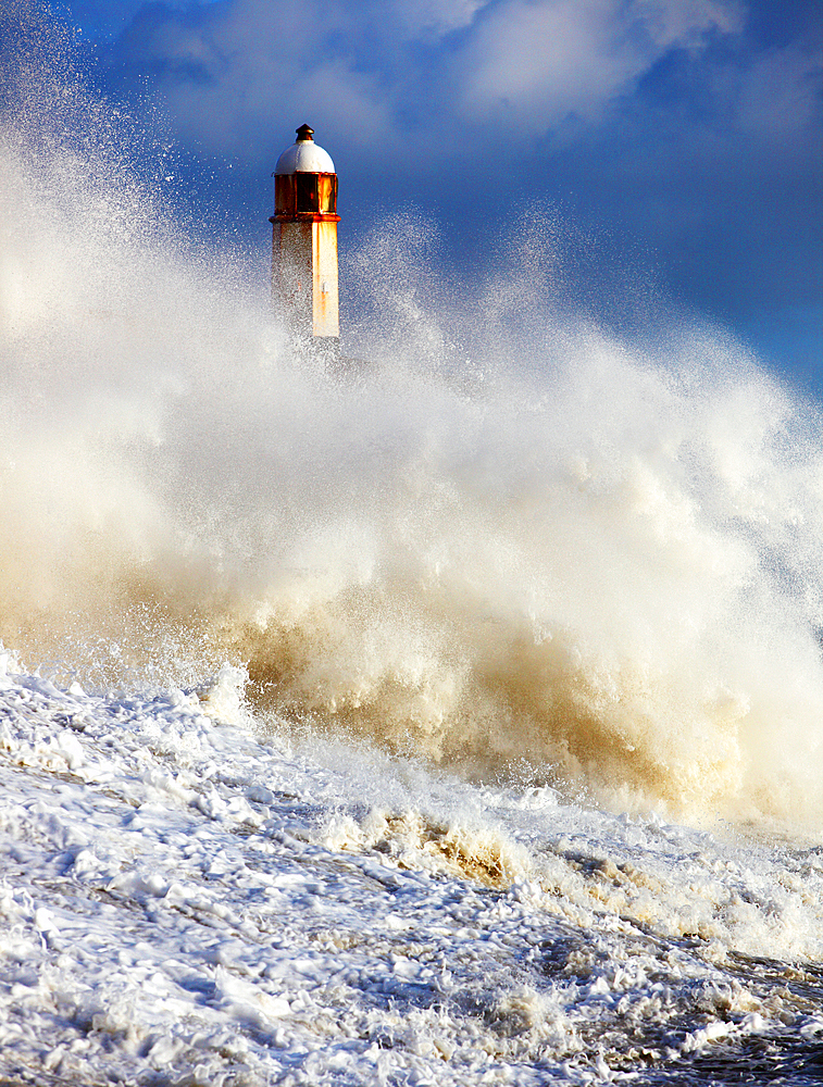 Storm waves over Porthcawl Pier, Porthcawl, South Wales, United Kingdom, Europe