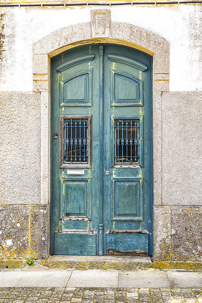 Europe, Portugal, Caminha. Porto. A green painted wooden door in Caminha.