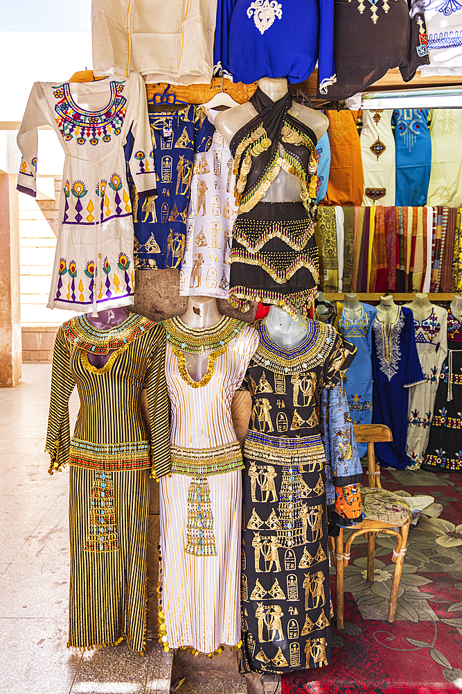 Edfu, Aswan, Egypt. February 25, 2022. Dresses outside a clothing store in Edfu.