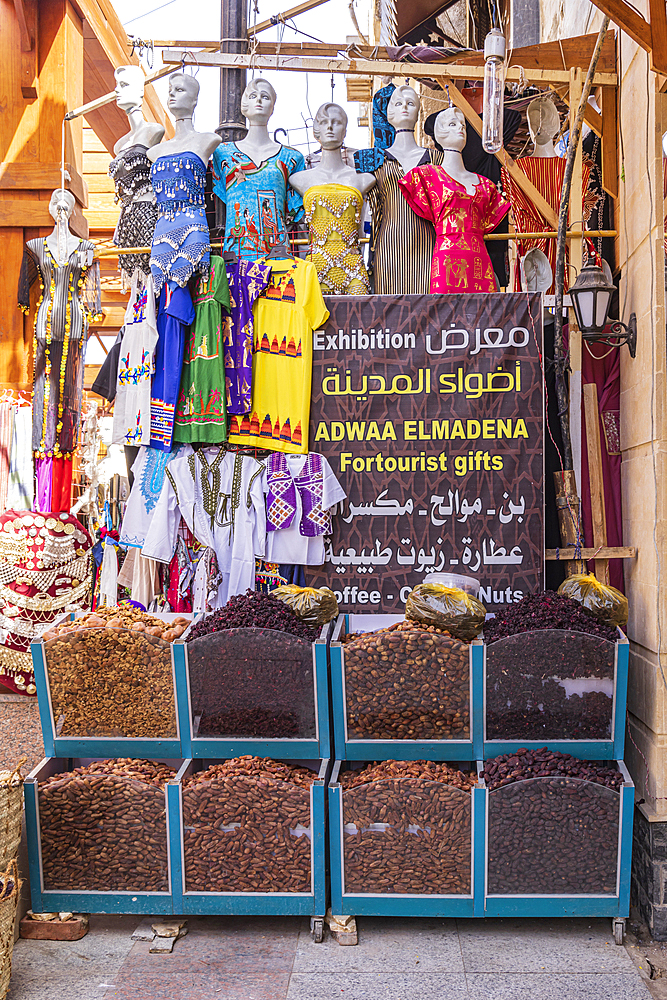 Thebes, Luxor, Egypt. February 24, 2022. Dried hibiscus and dates and women's dresses at a market in Luxor.