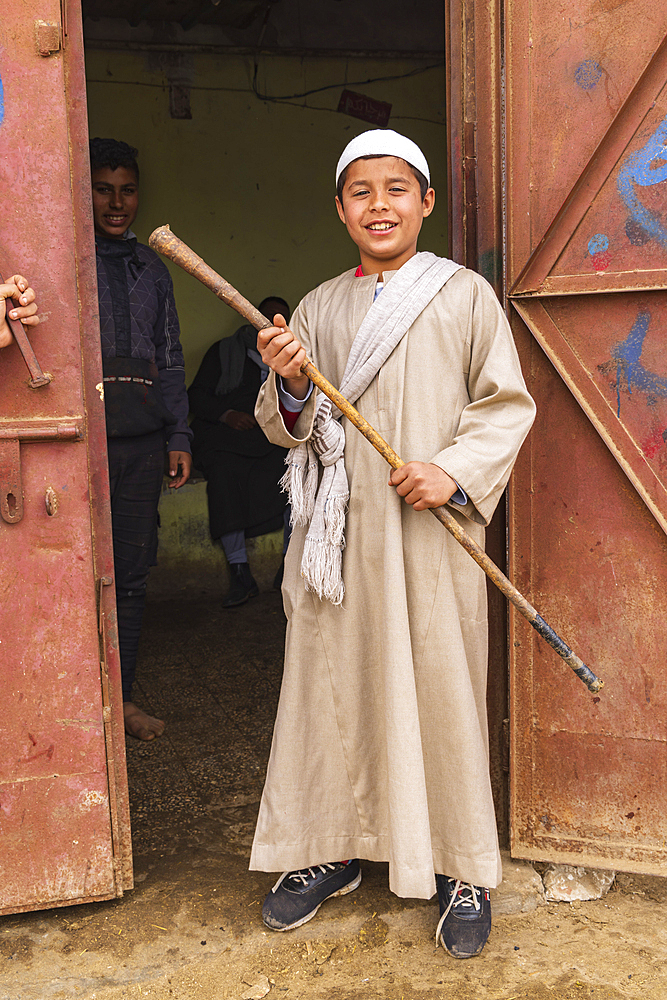 Birqash, Cairo, Egypt. February 18, 2022. A young man camel handler at a tea shop at the Birqash Camel Market outside Cairo.