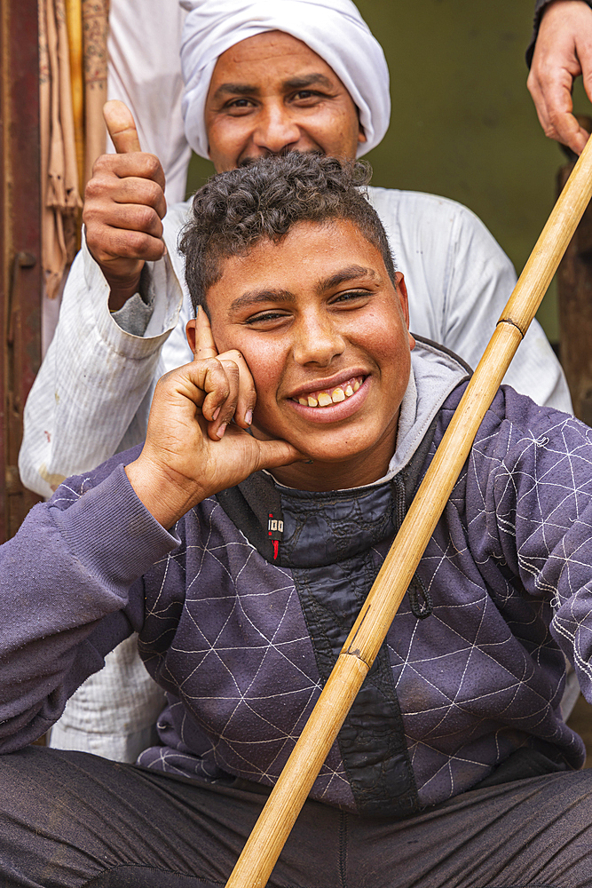 Birqash, Cairo, Egypt. February 18, 2022. A young man camel handler at a tea shop at the Birqash Camel Market outside Cairo.