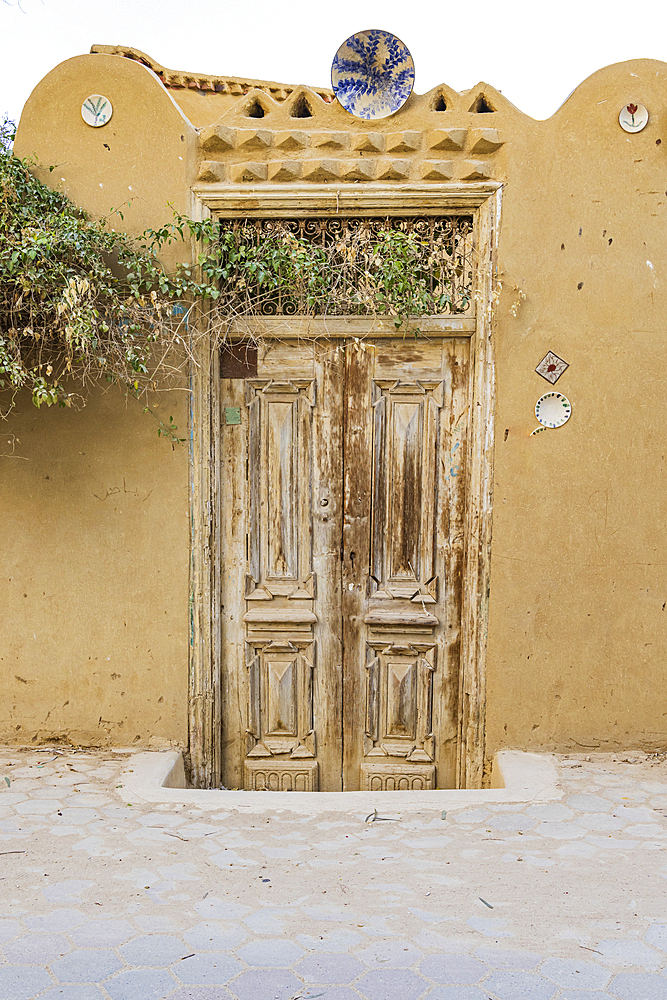 Faiyum, Egypt. Wooden door on a building in the village of Faiyum.