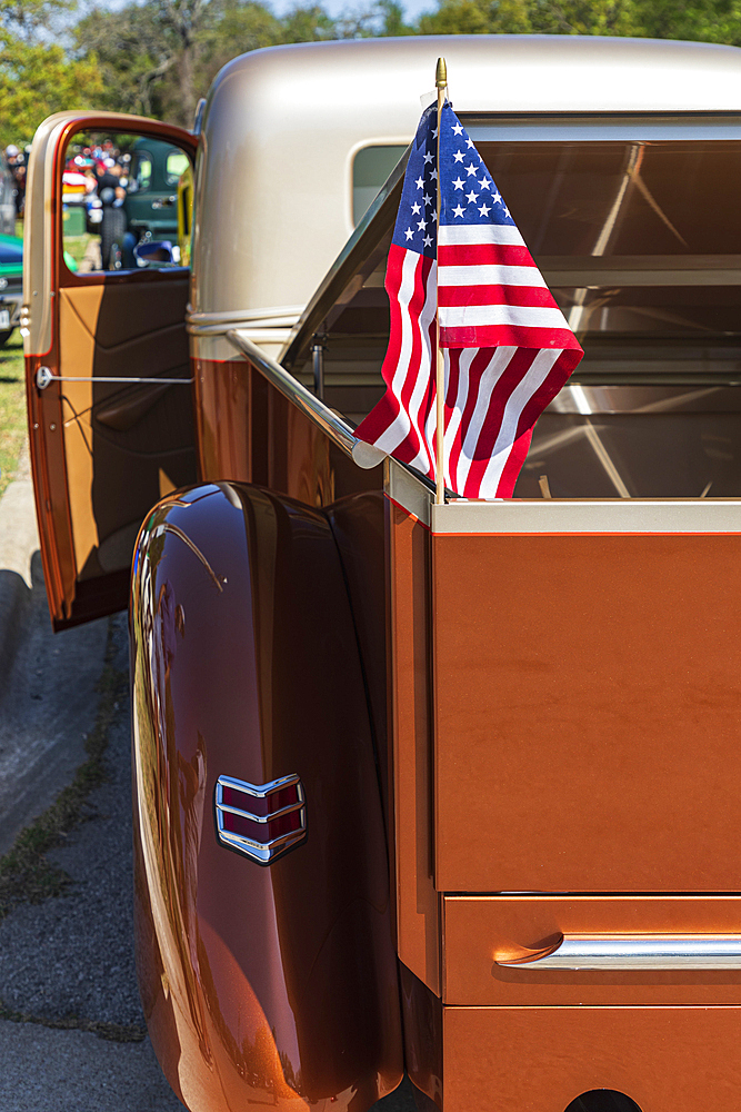 Marble Falls, Texas, USA. April 10, 2021. US flag in a vintage pickup truck.