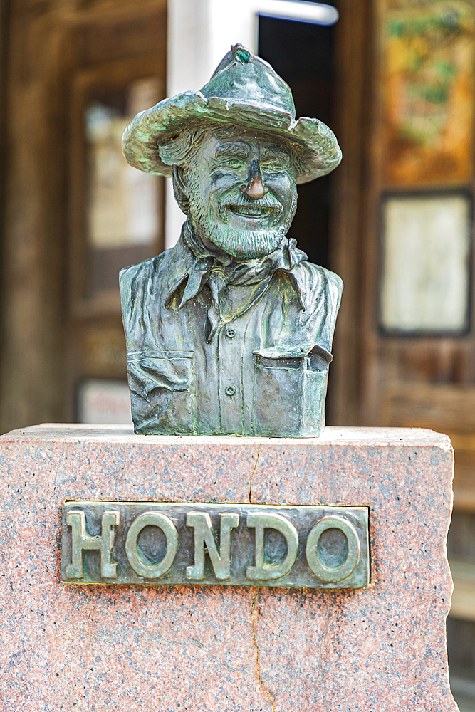 Luckenbach, Texas, USA. April 13, 2021. Statue of Hondo Crouch outside the post office in Luckenbach, Texas.