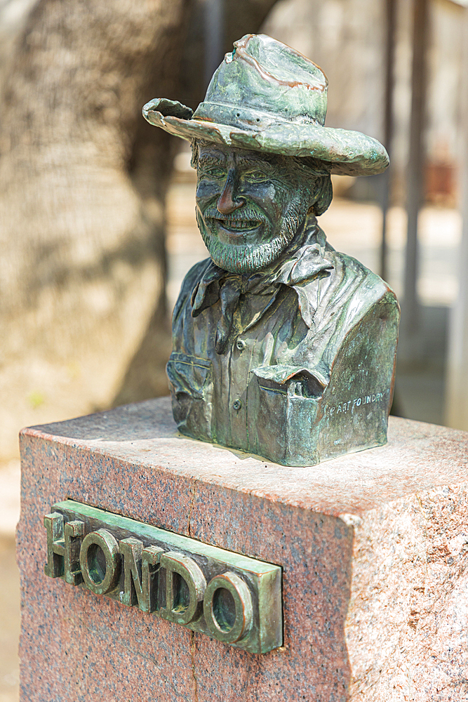 Luckenbach, Texas, USA. April 13, 2021. Statue of Hondo Crouch outside the post office in Luckenbach, Texas.