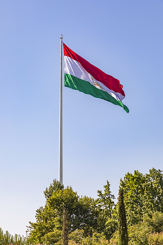 Dushanbe, Tajikistan. Tajik flag flying in Rudaki Park.