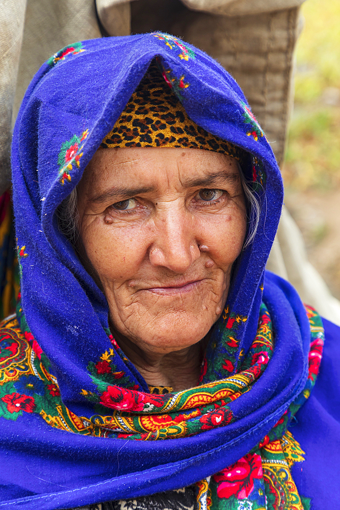 Rabot, Gorno-Badakhshan Autonomous Province, Tajikistan. August 14, 2021. A woman in a blue head scarf in rural Tajikistan. Editorial Use Only