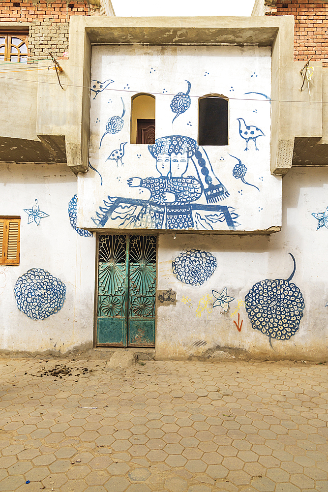 Faiyum, Egypt. February 19, 2022. Building decorated with murals in the village of Faiyum.