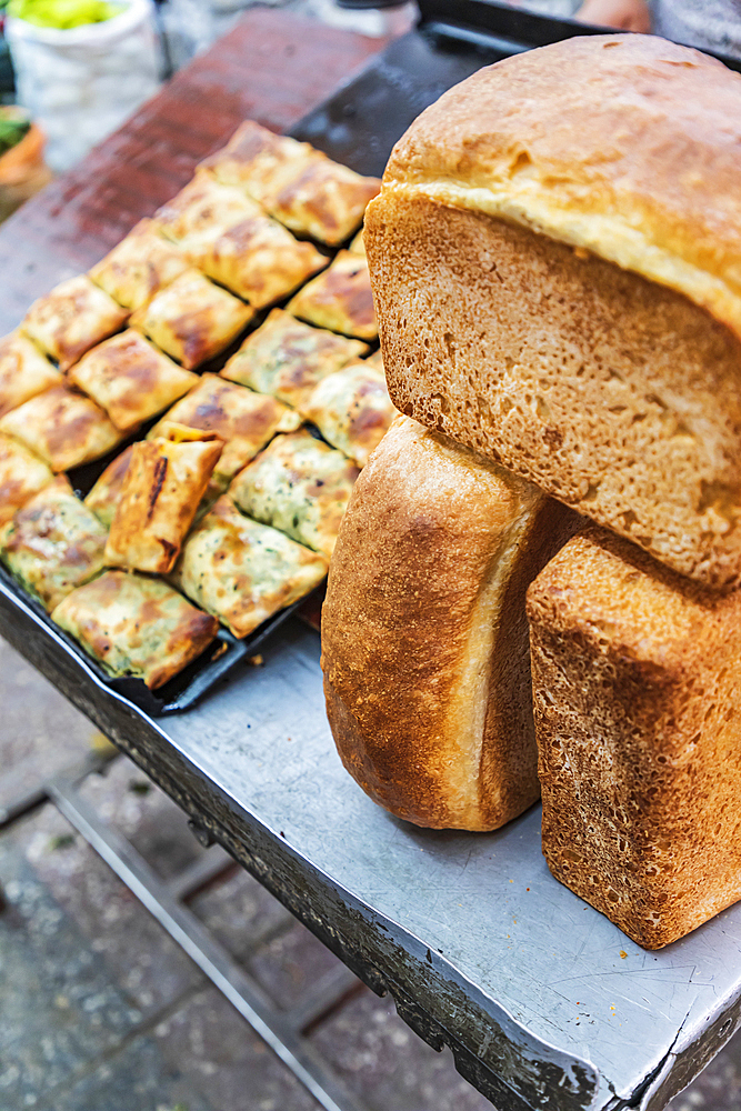 Khujand, Sughd Province, Tajikistan. Loaves of bread for sale at the Panjshanbe Bazaar in Khujand.