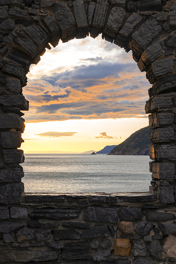 Beautiful sunset view of the Ligurian coast, viewed from the rock window of Portovenere village, La Spezia province, Liguria district, Italy, Europe