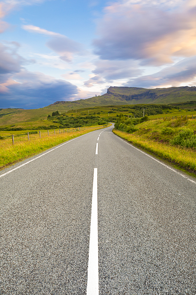 Classic Scottish road during a beautiful summer sunset, Isle of Skye, Inner Hebrides, Scotland, United Kingdom, Europe