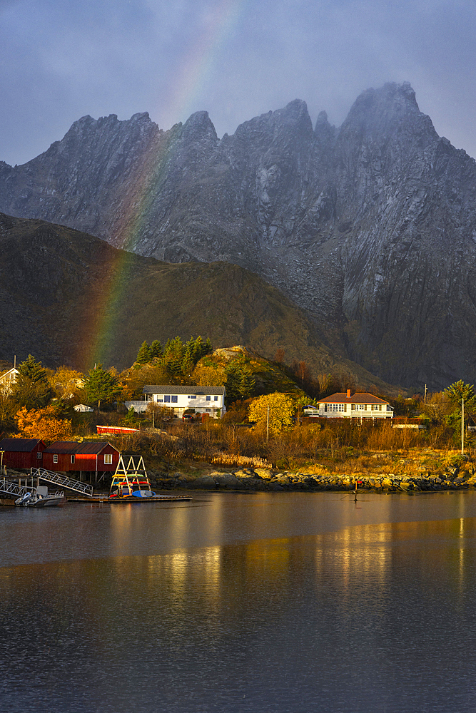 Mountains and rainbow from Ballstad harbour during sunrise, Vestvagoy, Nordland, Lofoten Islands, Norway, Europe