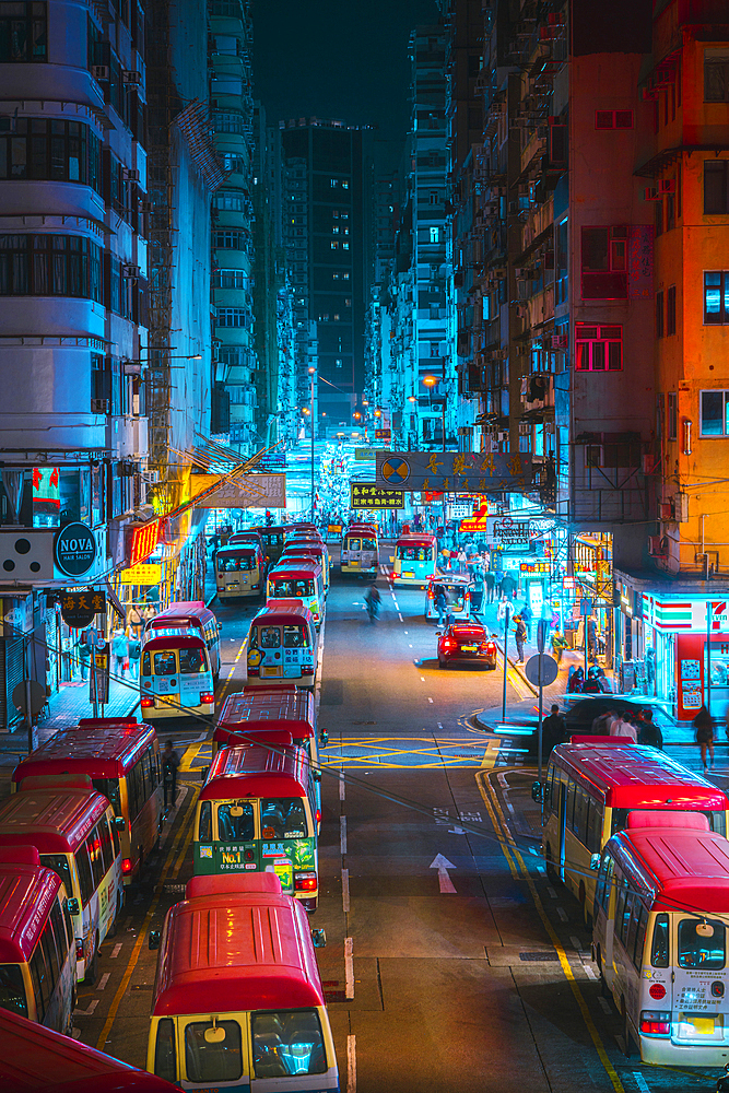 Tung choi street with typical buses during night, MongKok, Kowloon, Hong Kong, China, Asia