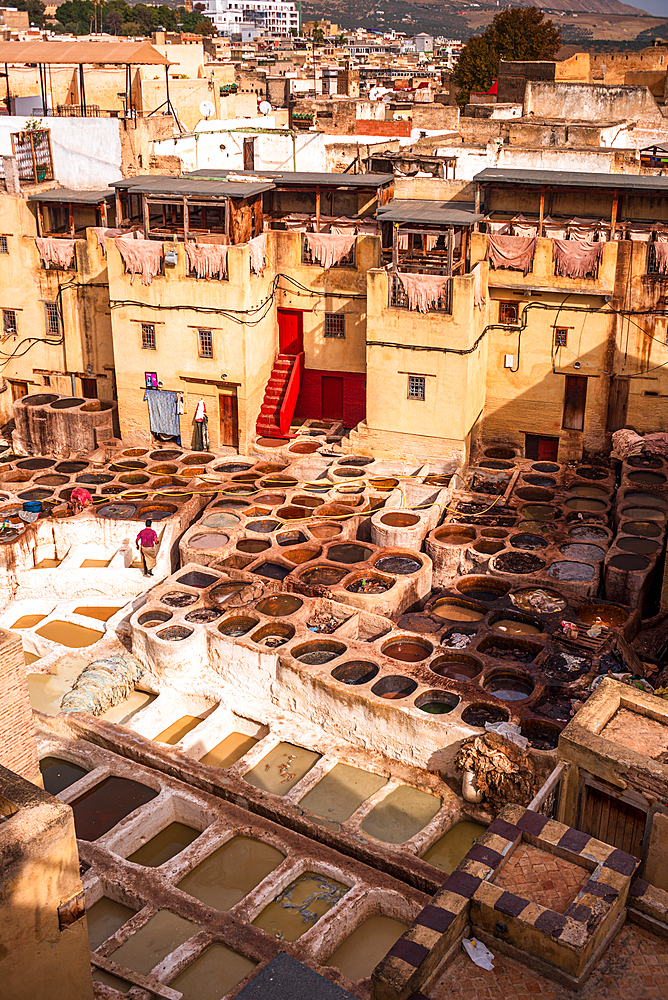 Aerial View of Chouara Tannery with Multicolored Dye Pits and Medina Buildings in Fes, Morocco