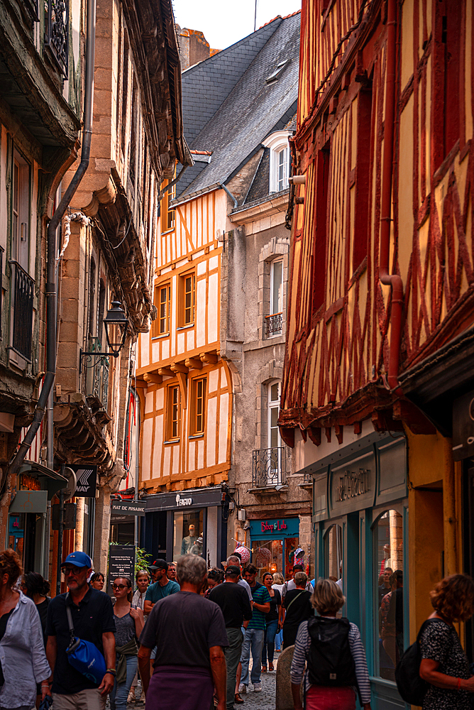 View along a narrow alley of half timbered houses in old town of Vannes, Britanny, France