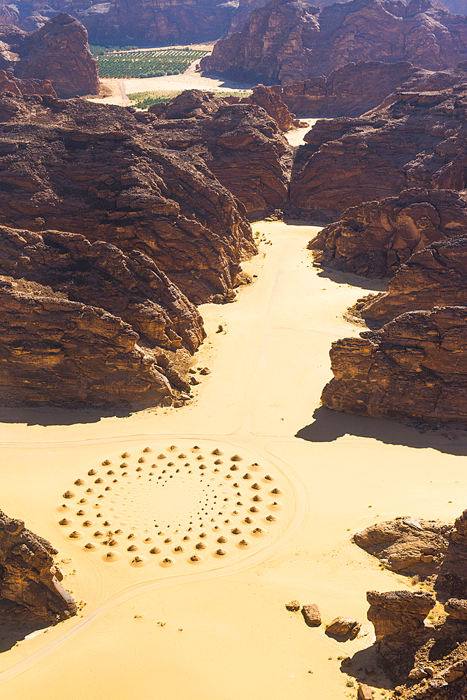 Aerial view of a work of land art in the middle of red sandstone formation, in the area of AlUla, Medina Province, Saudi Arabia, Middle East