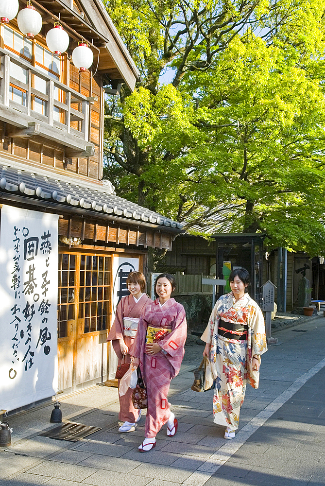 Three young women wearing traditional kimono in Oharai-machi Historic District, Ise, Mie prefecture, Japan
