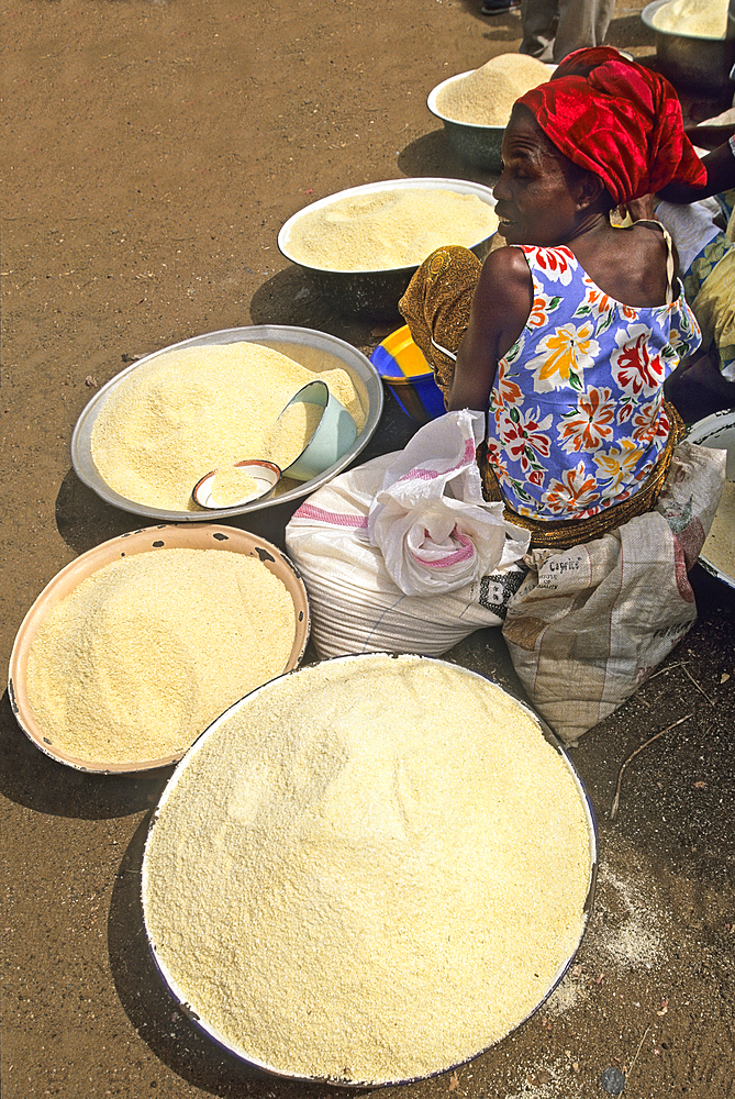 Vendor of cassava flour at the market, Benin, Africa
