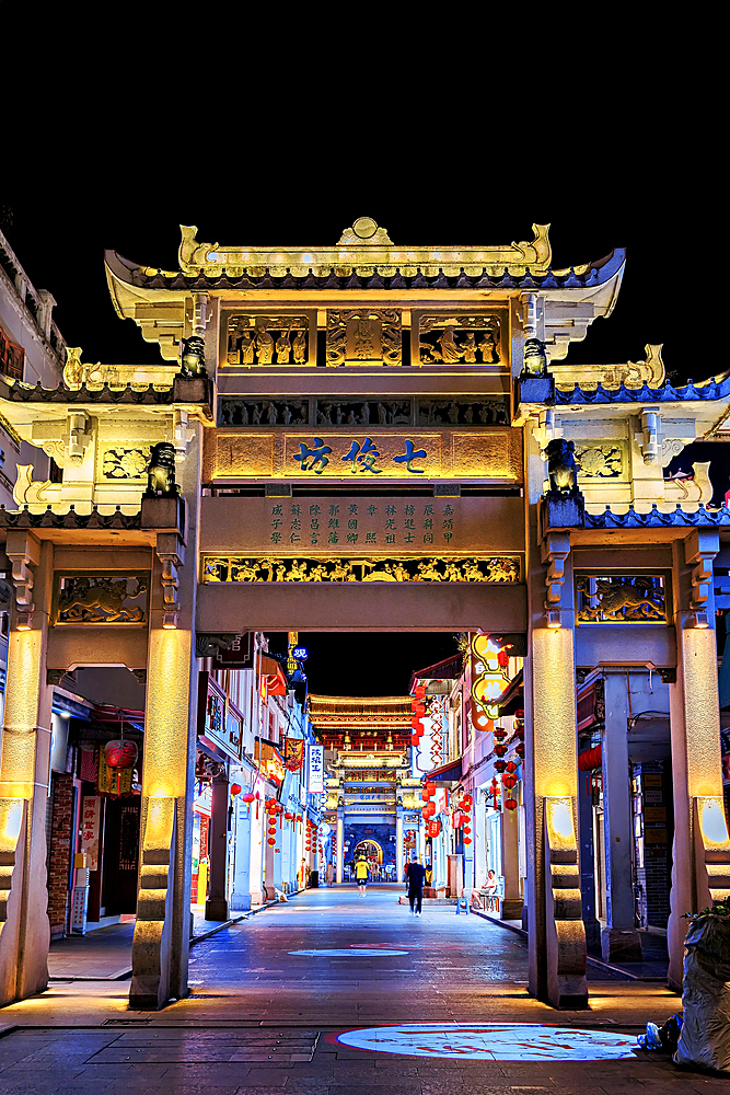 Paifang Street at night. These memorial arches (Paifang) are arches built to commend and commemorate celebrities and sages since 3000 years ago. The arches in Paifang Street were built between 1517 - 1785. Chaozhou, Guangdong Province, China