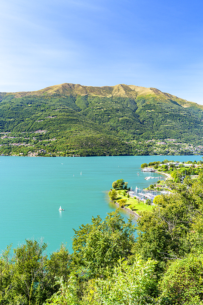 Boats sailing in Lake Como in summer, Dervio, Lecco province, Lombardy, Italy