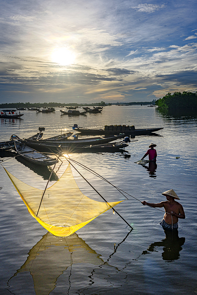 Traditional fishermen using nets at sunrise, Hue, Thua Thien-Hue province, Central Vietnam. (MR)
