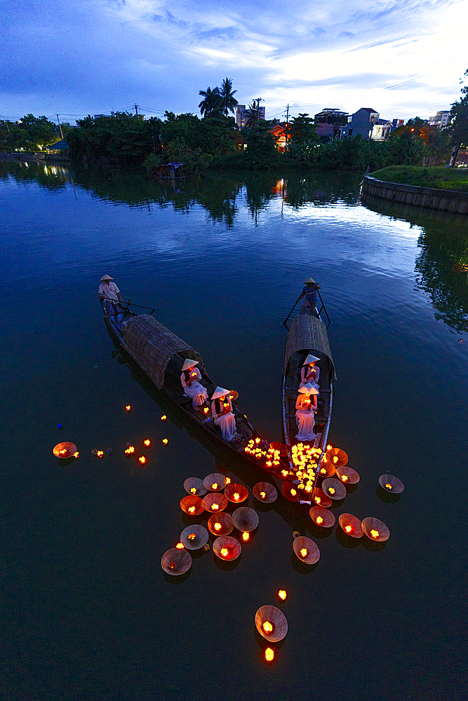 Floating lanterns carrying candles as prayers, Nhu Y River, Hue, Central Vietnam. (MR)