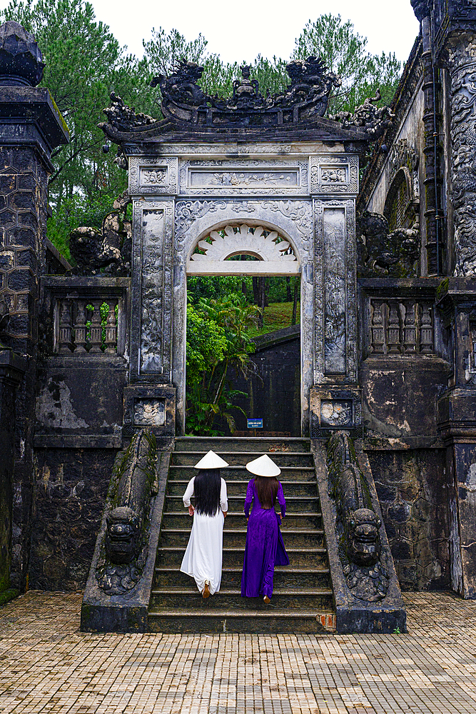 Elegant ladies on the steps of Khai Dinh Tomb, Hue, Central Vietnam. (MR)