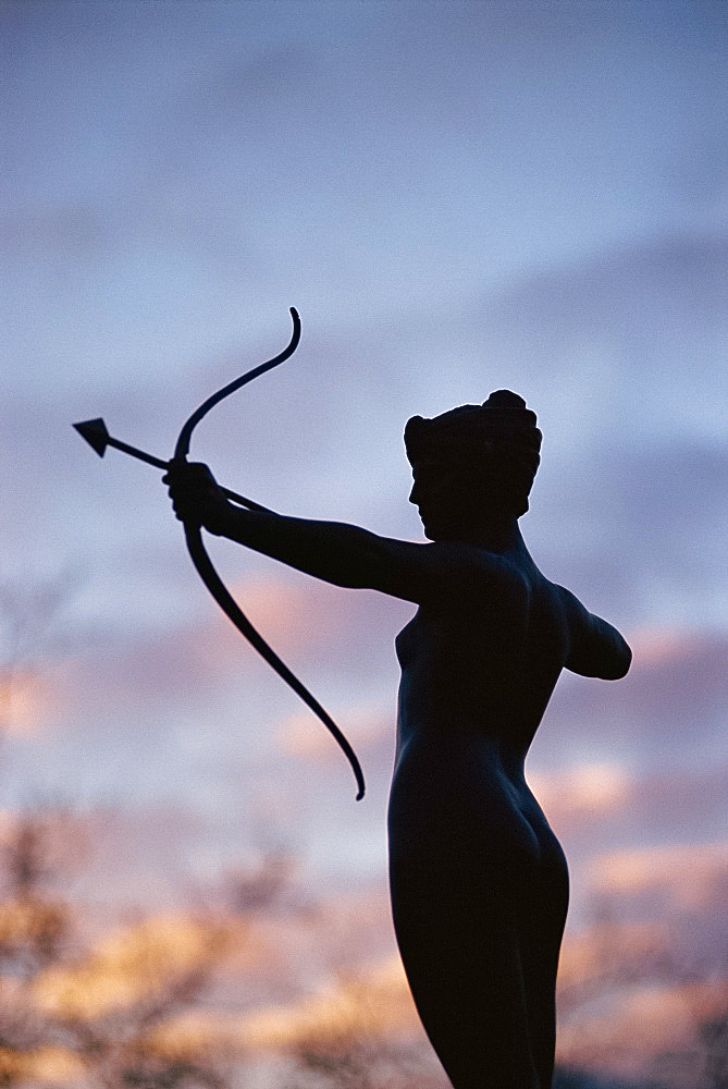 Statue silhouetted at dusk, Hyde Park, London, England, United Kingdom, Europe