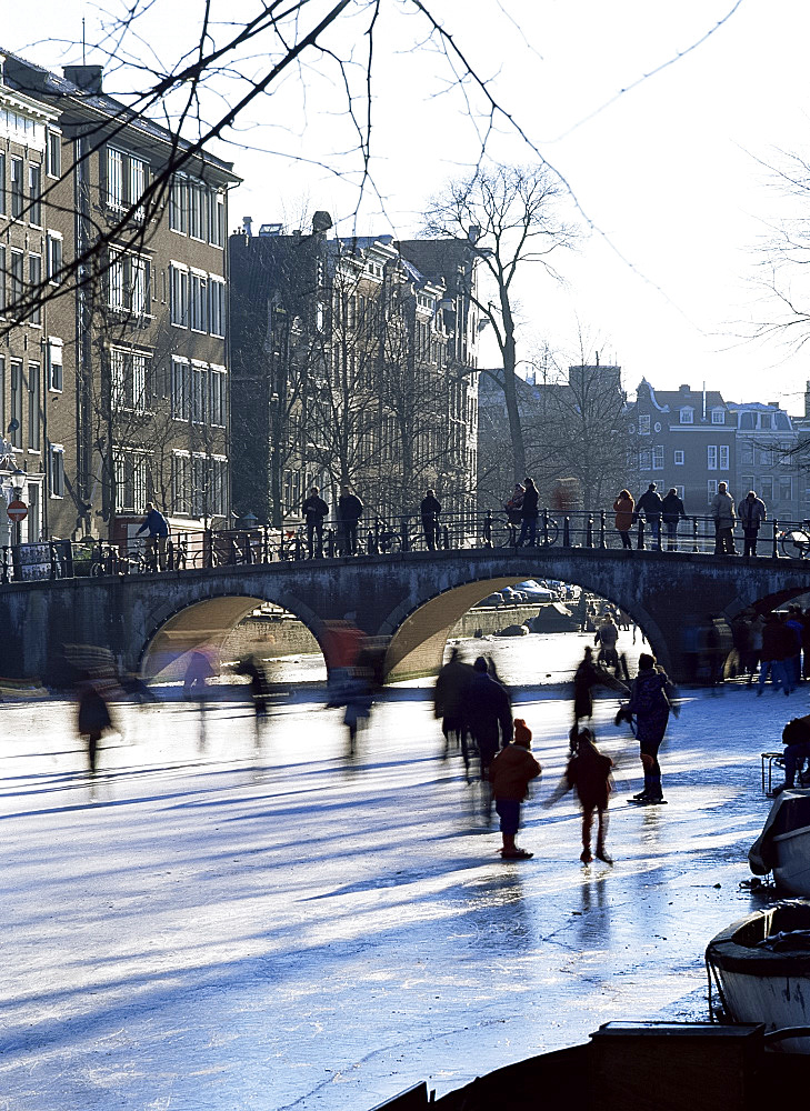 Skating in winter on the canals, Amsterdam, Holland, Europe