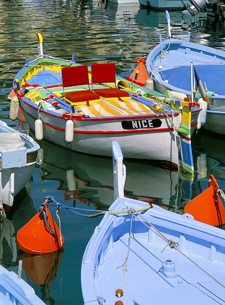 Brightly coloured wooden boats in the harbour, Nice, Alpes Maritimes, Provence, France, Europe