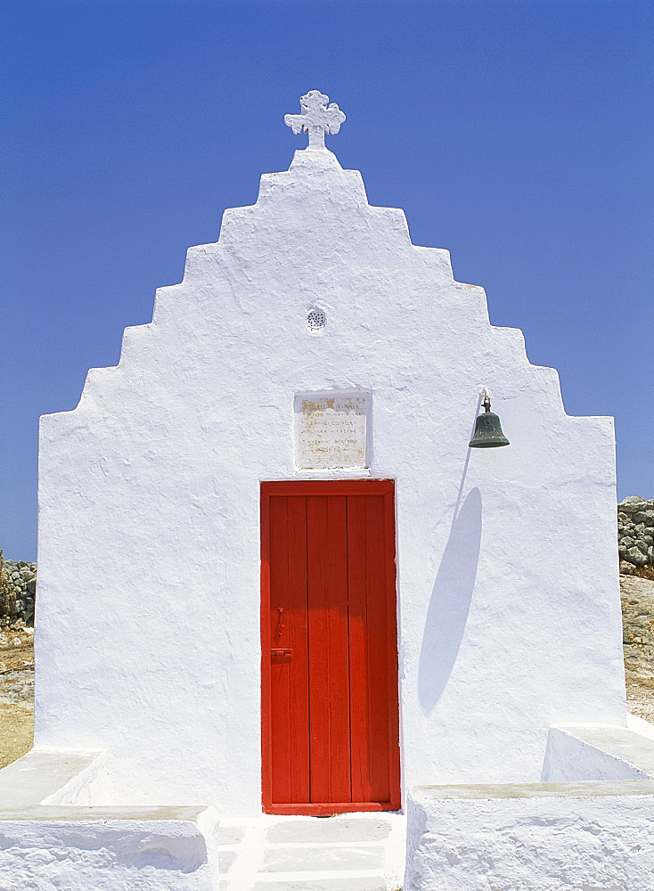 Close-up of red door in a whitewashed church on Mykonos, Cyclades, GreekIslands, Greece, Europe