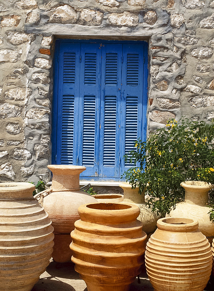 Greek urns in front of a blue door on Hydra, Argo Saronic Islands, Greece *** Local Caption ***