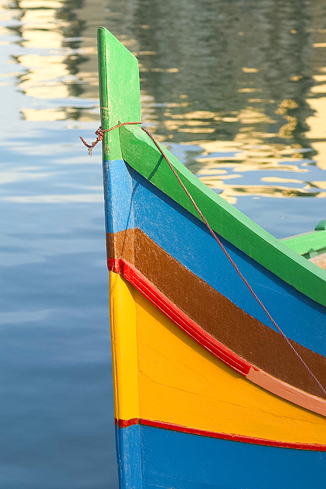 Wooden boat and reflections in the water, Malta, Mediterranean, Europe