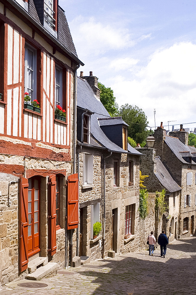 Old half timbered and stone buildings in the picturesque village of Dinan, Brittany, France, Europe