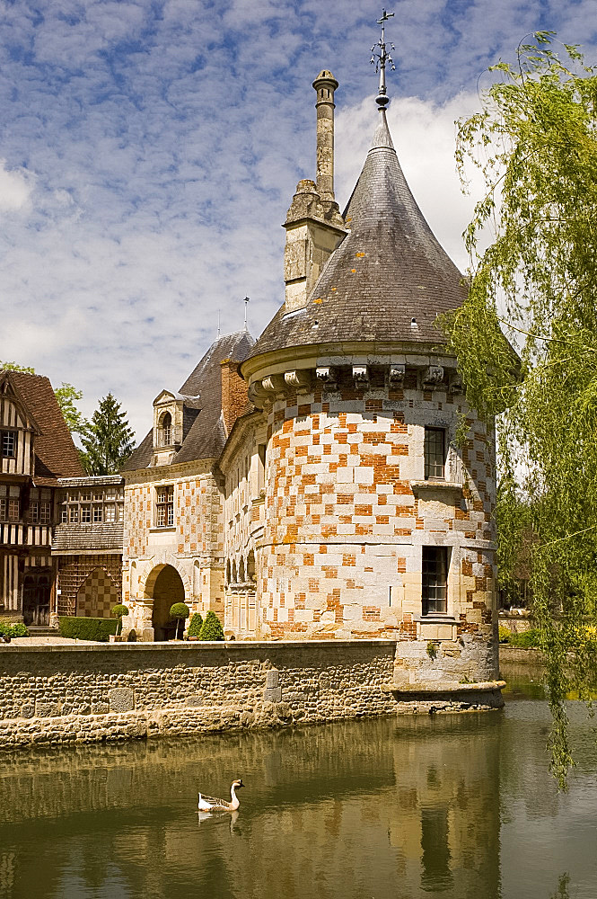 Checked tower of the chateau of St.-Germanine-de-Livet and surrounding moat, Normandy, France, Europe