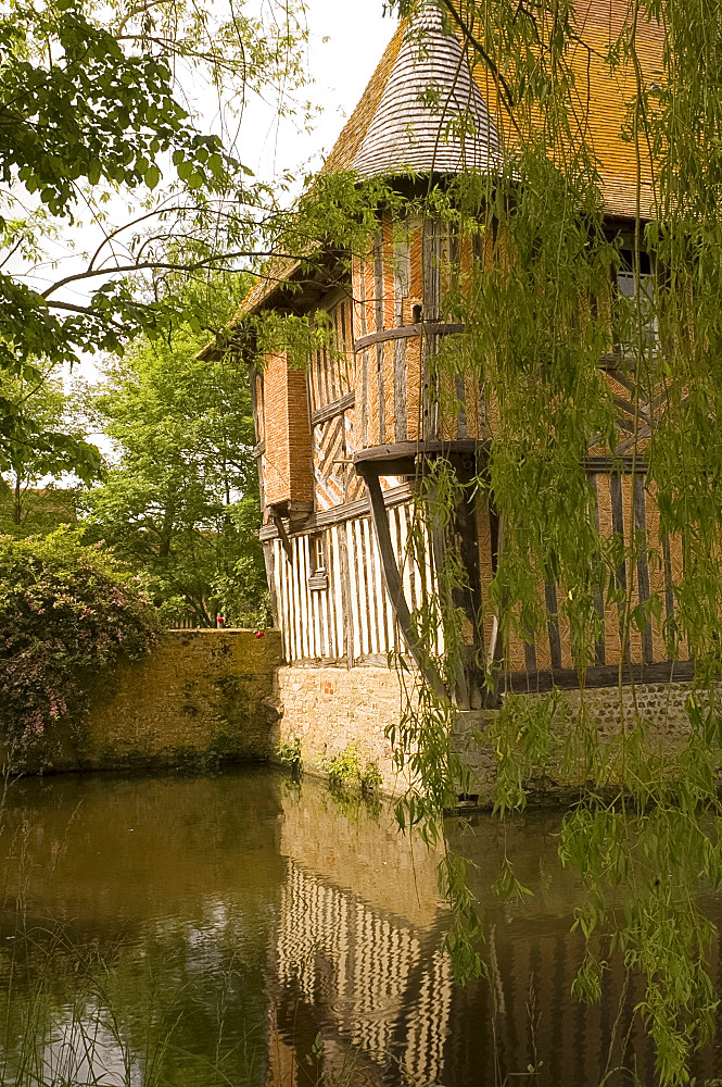 The half timbered manoire (manor house) and surrounding moat in Coupesarte, Basse Normandie (Normandy), France, Europe