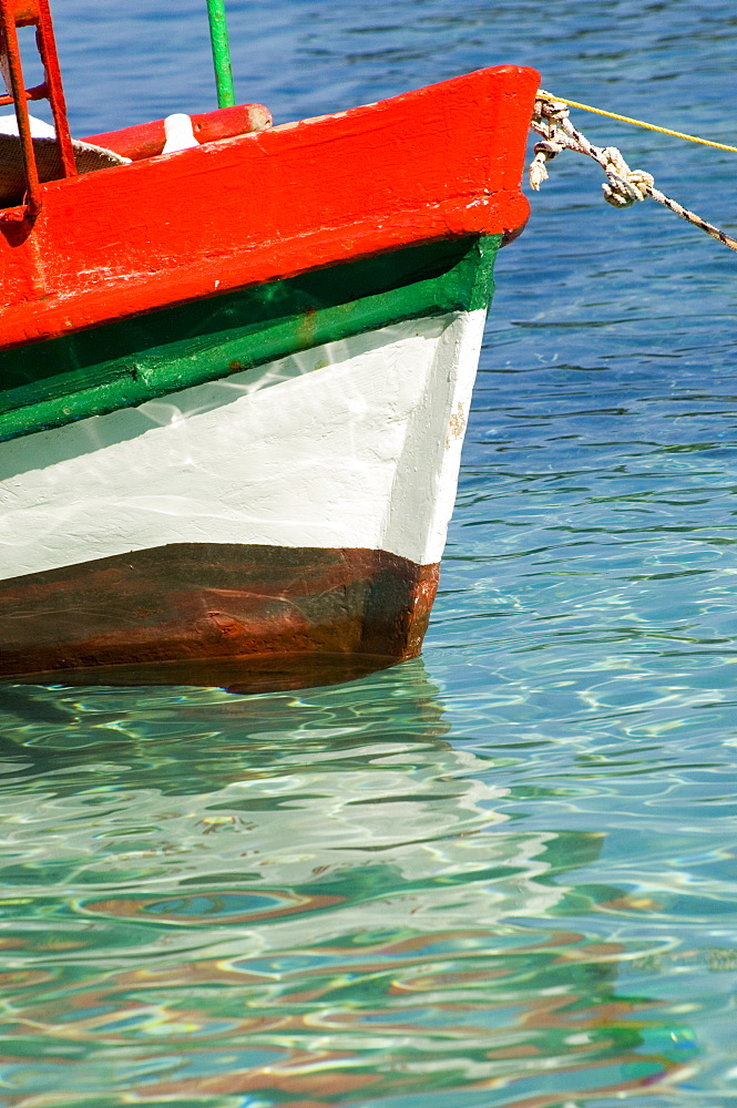 A colourful fishing boat in the harbour in Loggos, Paxos, Ionian Islands, Greek Islands, Greece, Europe