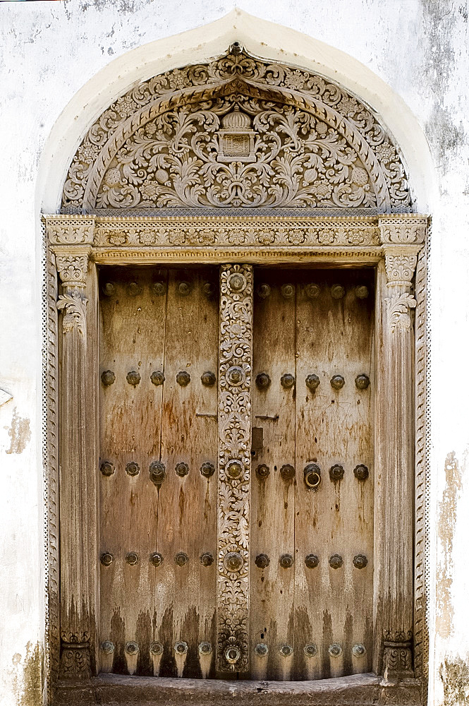 An example of an intricately carved wooden Arab door, Stone Town, UNESCO World Heritage Site, Zanzibar, Tanzania, East Africa, Africa