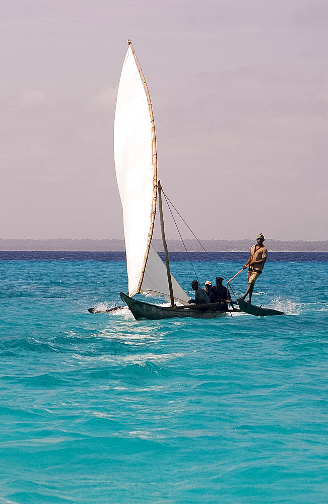 A traditional wooden sailing dhow near Mnemba Island, Zanzibar, Tanzania, East Africa, Africa