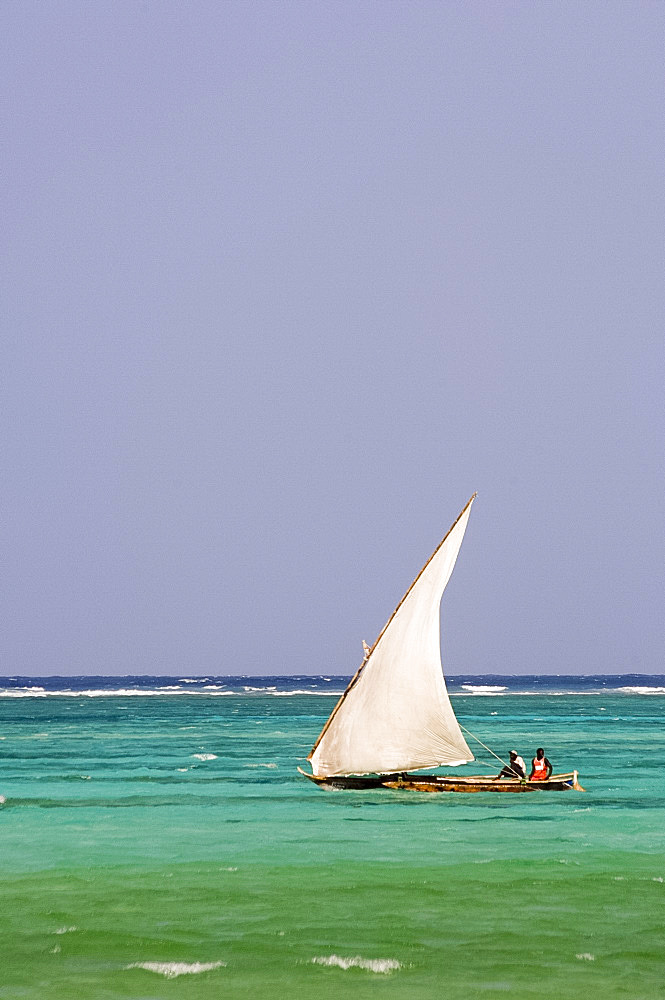 A traditional wooden sailing dhow near Mnemba Island, Zanzibar, Tanzania, East Africa, Africa