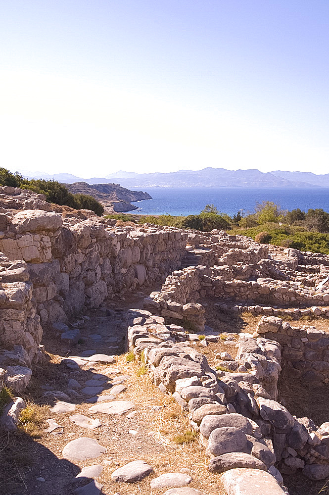 Low stone walls at the ancient Minoan town of Gournia above the Gulf of Mirambellou, Crete, Greek Islands, Greece, Europe