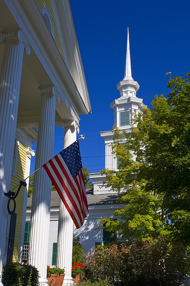 An American flag and the Presbyterian Church in Rensselaerville, New York State, United States of America, North America