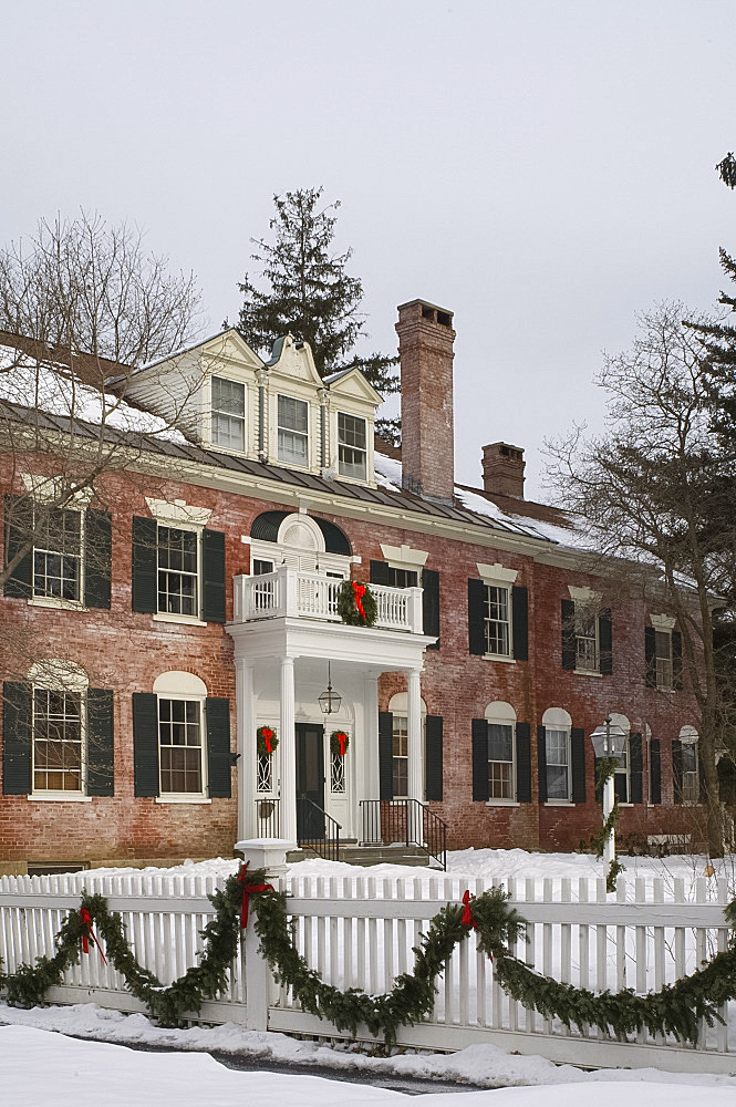 An imposing red brick house decorated for Christmas with wreaths and garlands, Woodstock, Vermont, New England, United States of America, North America