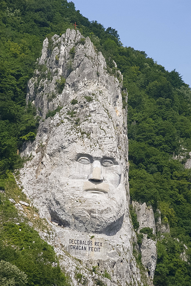 A rock sculpture of Decebalus, last prince of the Dracinians, on a hillside in the Kazan Gorge area of the Danube River, Romania, Europe