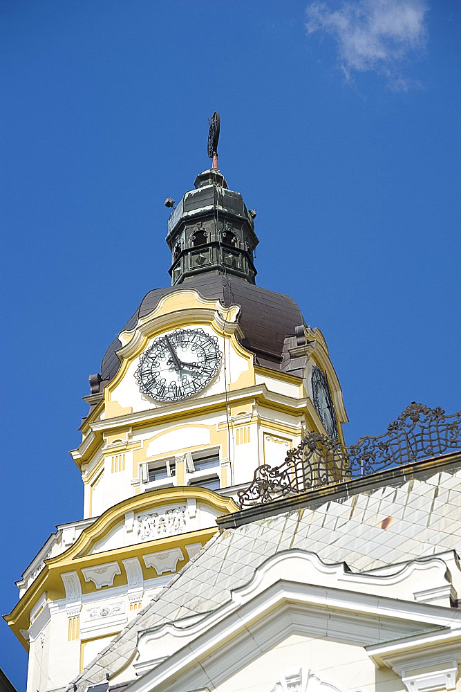 An ornate clock tower on the Town Hall, Pecs, Hungary, Europe