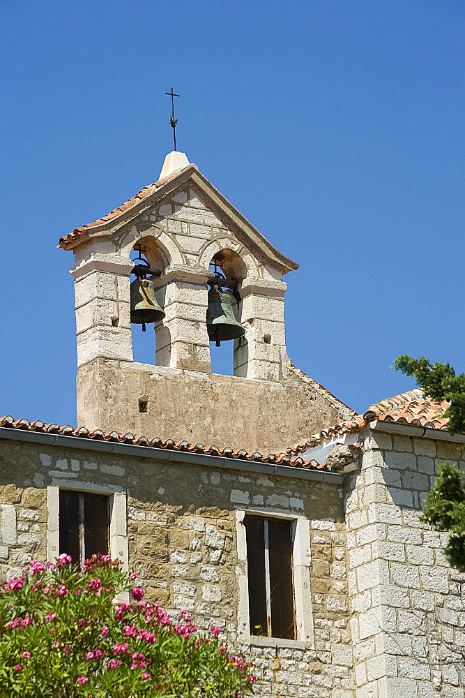 A bell tower at the Franciscan monastery of St. Eupehmia on the island of Rab, Kvarner region, Croatia, Europe