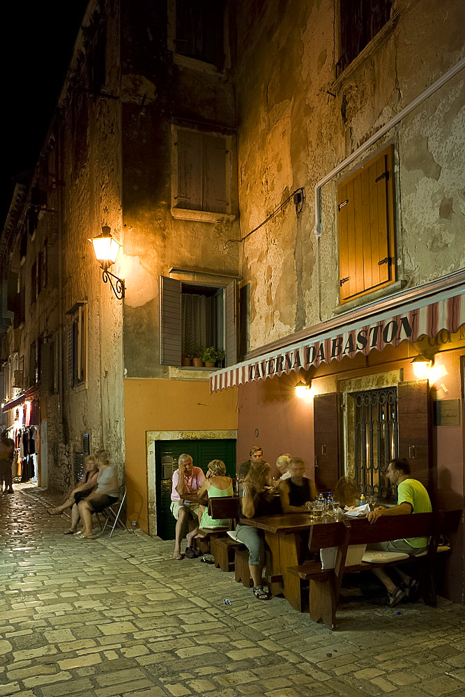 Restaurant tables on a small side street in Rovinj, Istria, Croatia, Europe