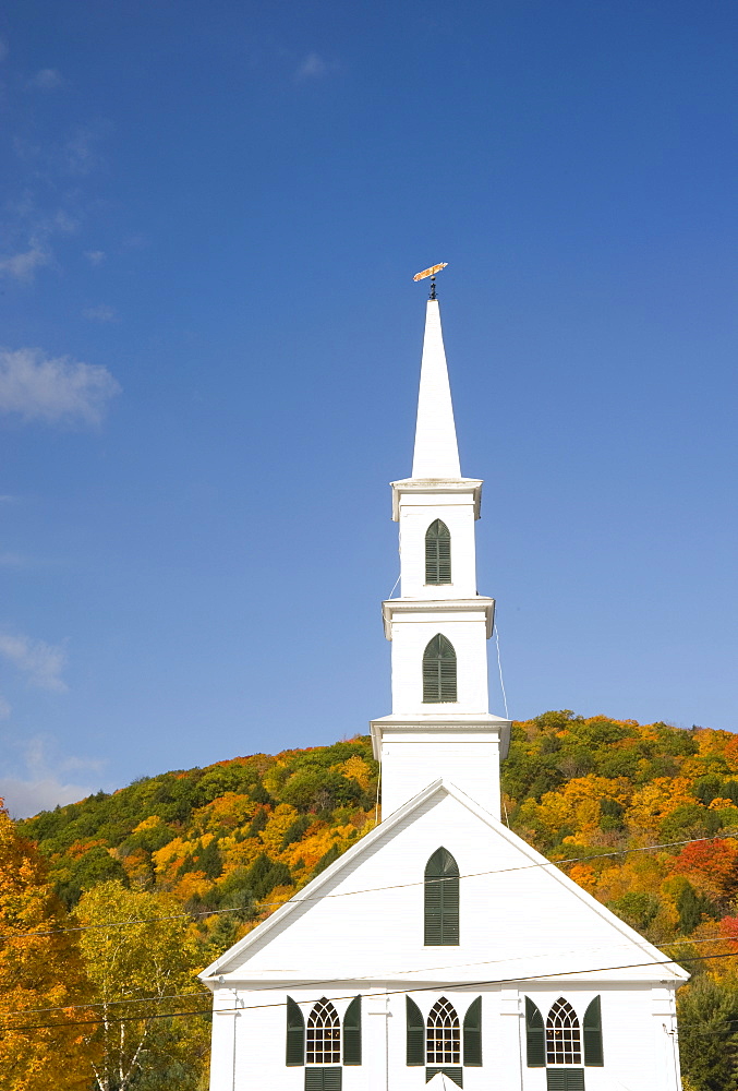 Autumn foliage on a hill behind the old Congregational church in Newfane, Vermont, New England, United States of America, North America