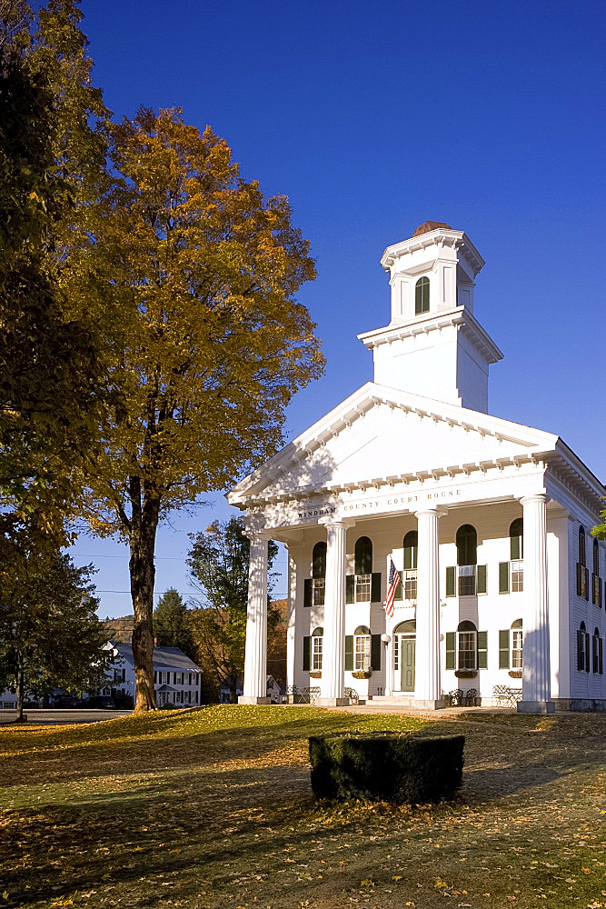 Autumn foliage surrounding the Windham County Courthouse, a Greek revival style building on the village green in Newfane, Vermont, New England, United States of America, North America